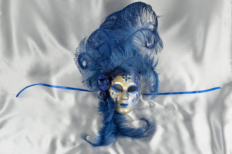 Blue wall mask with feathers