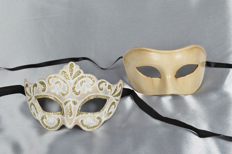 Pair of cream and gold masquerade masks