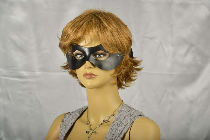 Leather batman masquerade mask on female model face