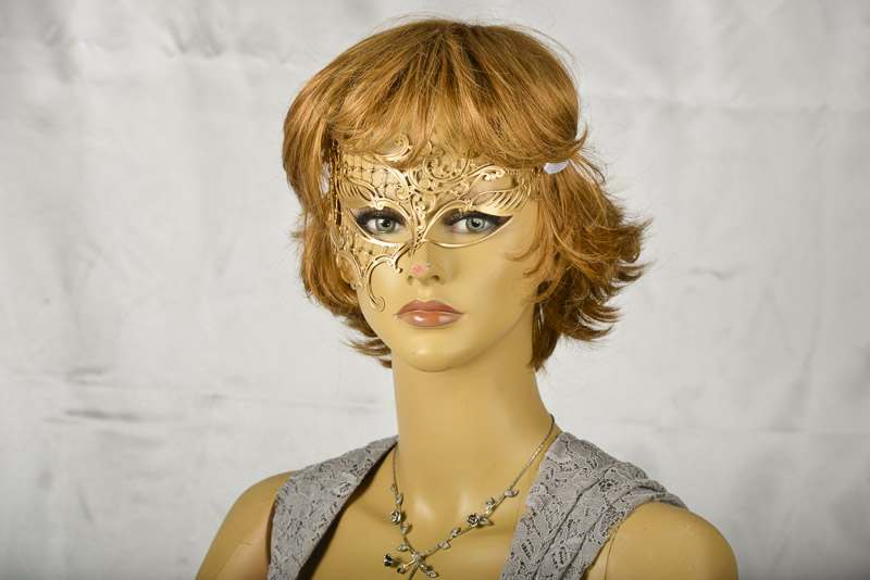 Gold filigree metal mask on model