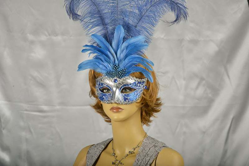 Luxury tall feather masquerade mask on female face