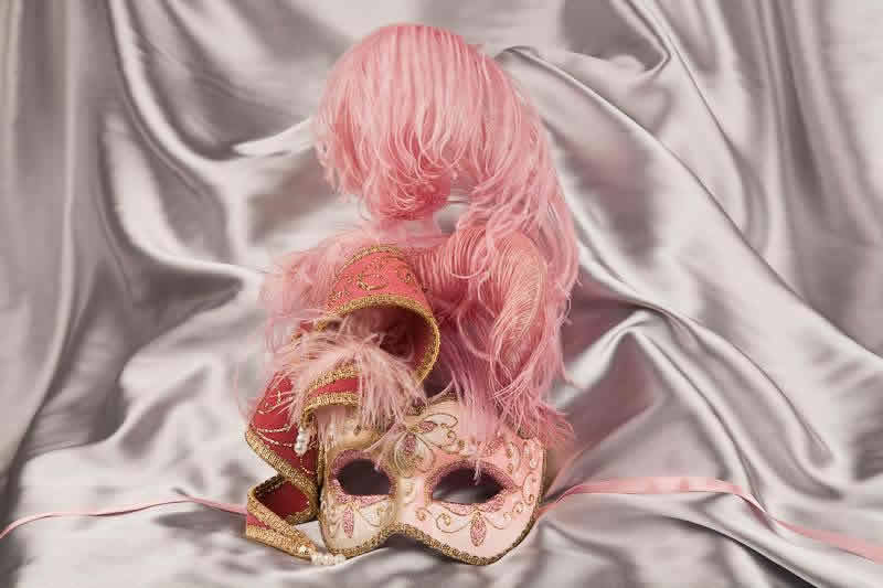 Gold trim Venetian jolly mask with feathers and jester bells in pink