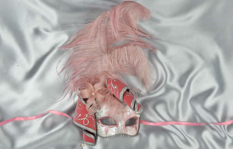 pink and silver trim Venetian jolly mask with feathers and jester bells