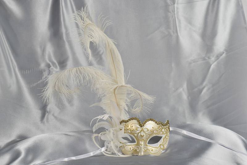 White and gold feathered mask