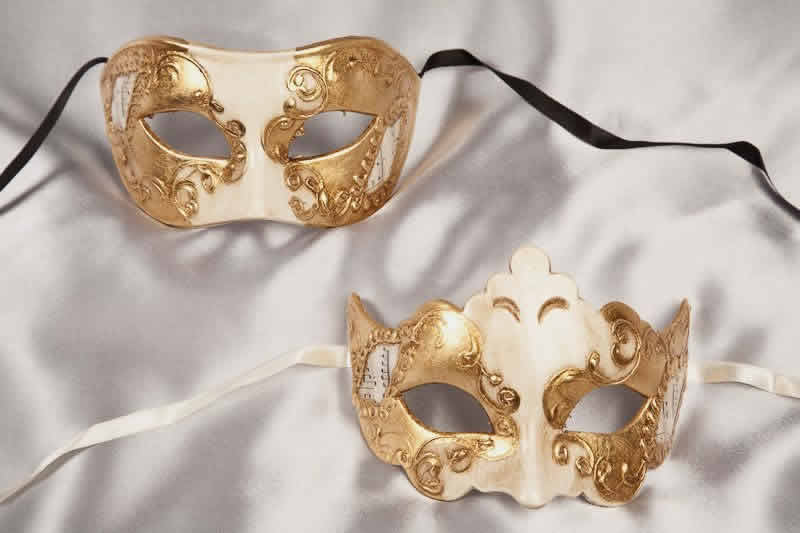 white and gold pair of masks