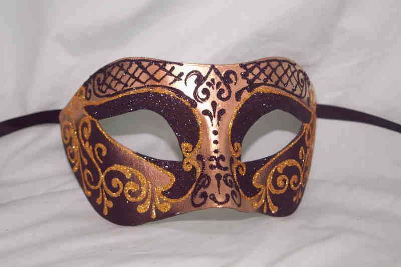 Carnival masquerade mask in gold and black