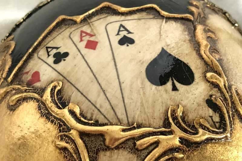 Four aces on a masquerade mask