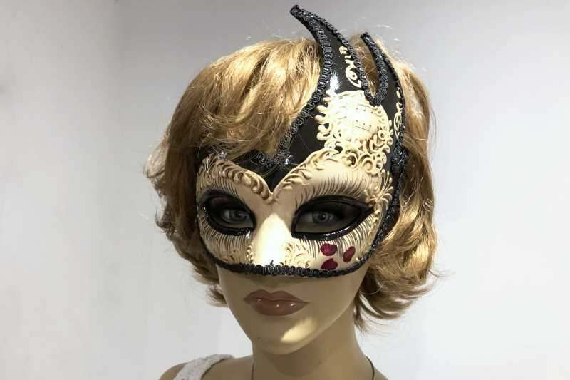 Black love hearts masquerade mask on female model face
