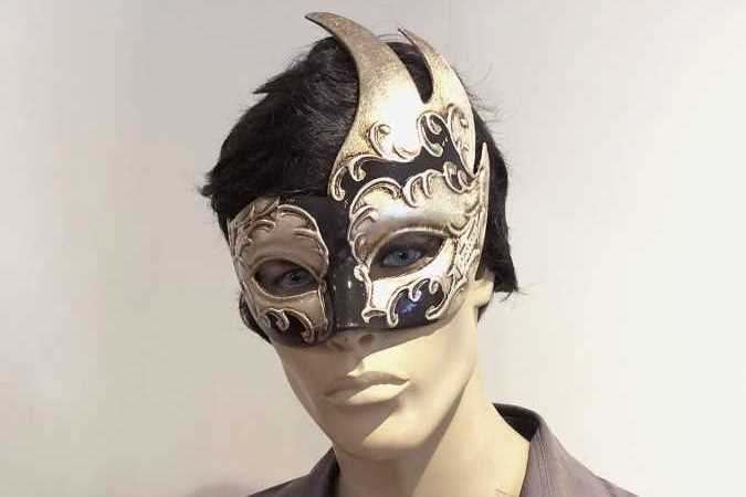 swan shaped animal masquerade mask in black and silver on male face
