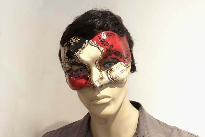 Joker Vivaldi masquerade beak mask on male face