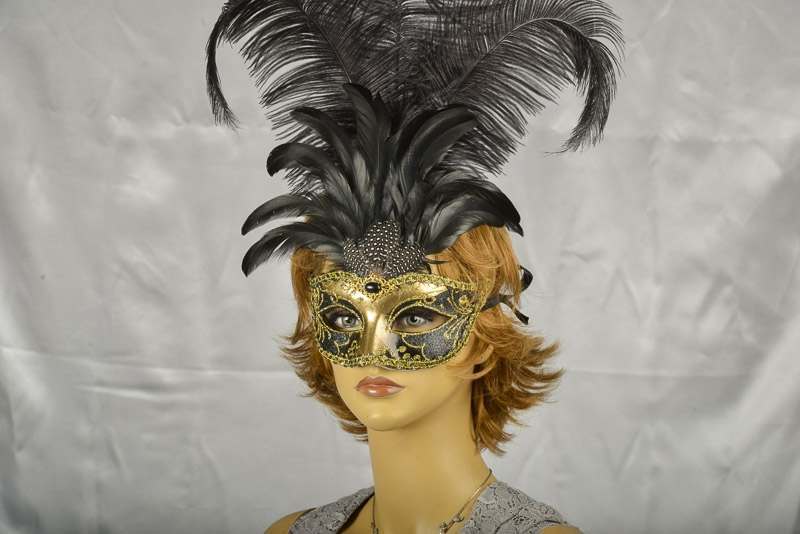 Luxury tall feather masquerade mask on female model face
