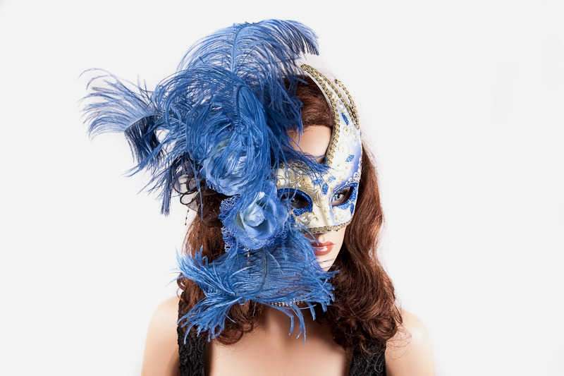 Gold Venetian Swan Masks with feathers in blue on model face Gold Venetian Swan Masks with feathers in blue on model face