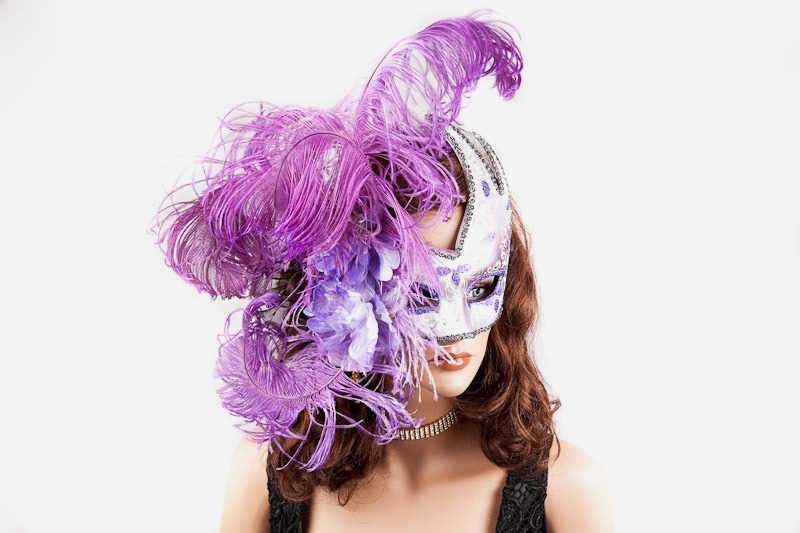 Luxury feathered mask for women shown on female model face