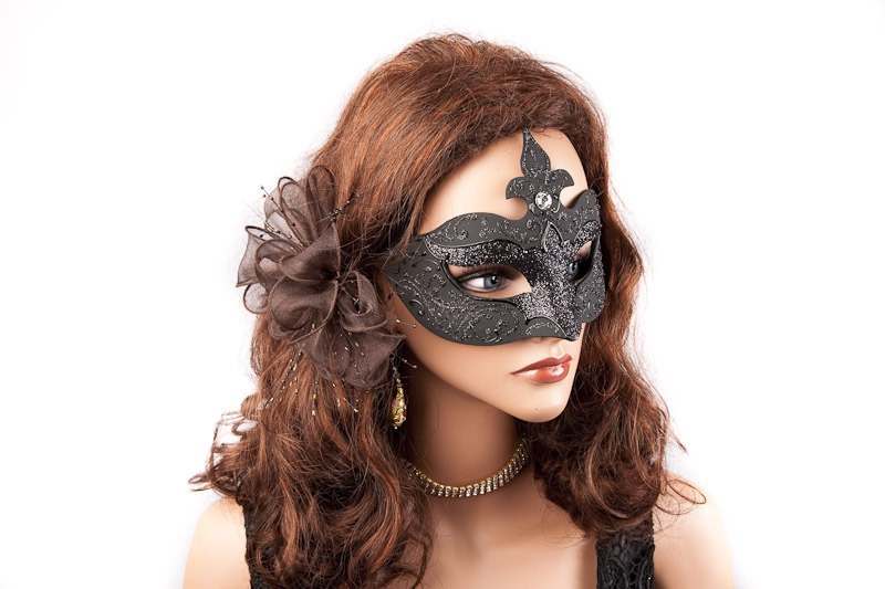 black masquerade mask for a woman on female face