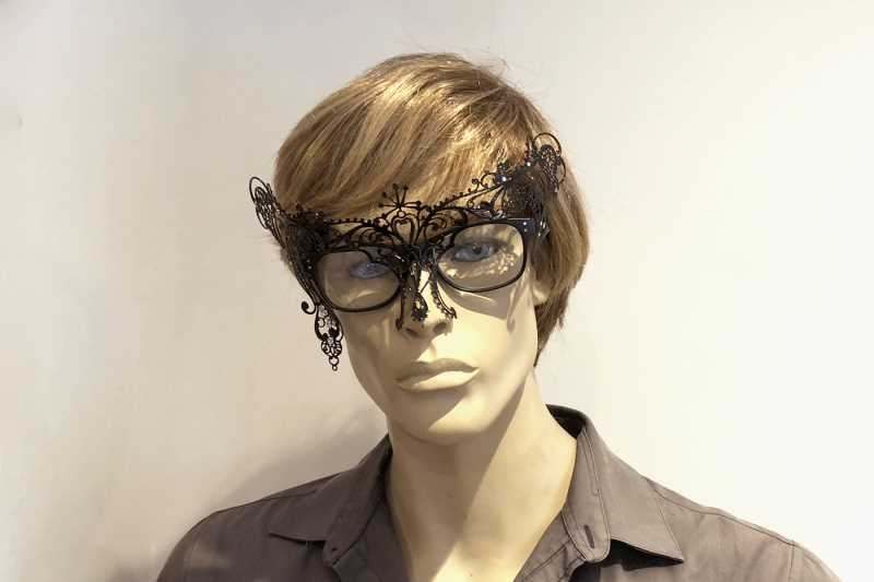 masquerade mask that attaches to glasses frames shown on man